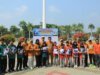 Erwin Burase Serahkan Seragam Sekolah Gratis dan Terima Bantuan Mobil Dapur Lapangan dari BPBD